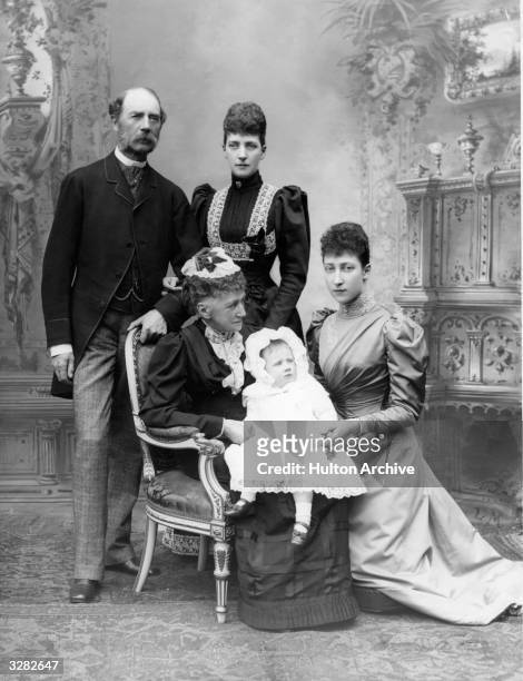 Standing, from left, Kristian IX of Denmark, father of Queen Alexandra; and Queen Alexandra, , queen-consort of Edward VII. Seated is the Queen of...