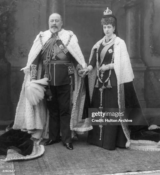 King Edward VII, , who ascended the British throne in 1901, with his queen-consort Queen Alexandra, , at the State Opening of Parliament in London.