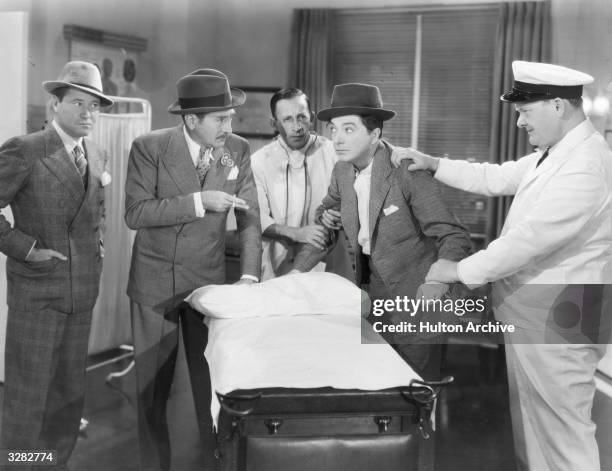 Jack Oakie formerly Lewis D Offield, the American comic actor is viewed with Jack Haley the American light comedian and Adolphe Menjou the...