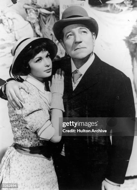 French actress Francoise Arnoul, the stage name of Francoise Gautsch, stars with Jean Gabin the stage name of Alexis Moncourge, in Jean Renoir's film...