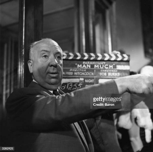 Film director and auteur Alfred Hitchcock filming 'The Man Who Knew Too Much', a Paramount remake of his 1934 spy thriller.