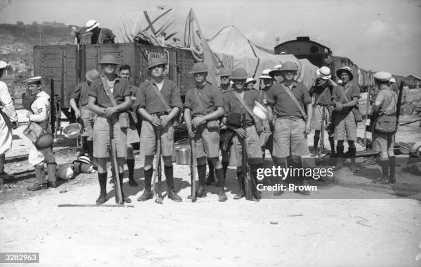 British Navy troops, some from HMS Arethusa, guarding an armoured train at Haifa in Palestine.