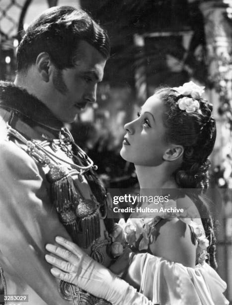 John Loder as Alexander of Russia, defies etiquette by waltzing with Danielle Darrieux, in the film 'Katia'.