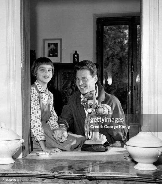 French Hollywood film star Jean Pierre Aumont , at his home 'Les Rochers' with his daughter Marie.