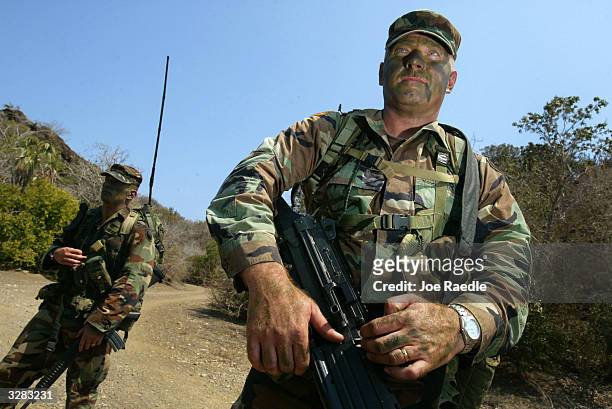 Army Sergeant Scott Boutell from Orange, Massachussetts and Sergeant Ronald Bozsar from Worschester, Massachussetts as they participate in a patrol...