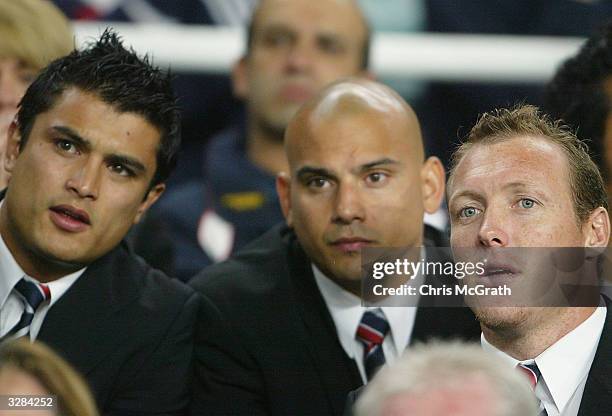 Injured Roosters Craig Wing, Shannon Hegarty and Craig Fitzgibbon watch on from the bench during the NRL round five match between the Sydney Roosters...