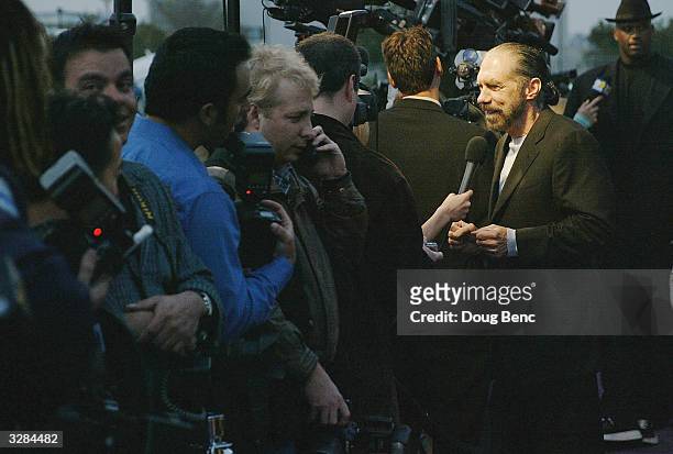 John Paul DeJoria is interviewed as he arrives for the 1st Annual Palms Casino Royale to benefit the Los Angeles Lakers Youth Foundation on April 8,...