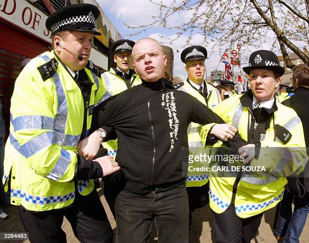 National Front member is arrested during a protest at the Finsbury Park Mosque as Muslim cleric Abu Hamza speaks to his followers only metres away 09...