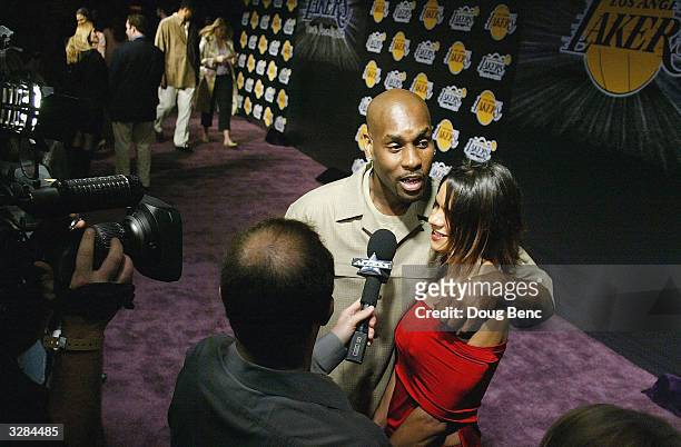 Gary Payton of the Los Angeles Lakers and Wife Monique arrive for the 1st Annual Palms Casino Royale to benefit the Los Angeles Lakers Youth...