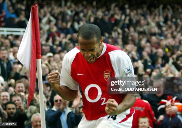 Arsenal's French forward Thierry Henry celebrates his first goal setting up hat trick against Liverpool during their premier league clash at Highbury...