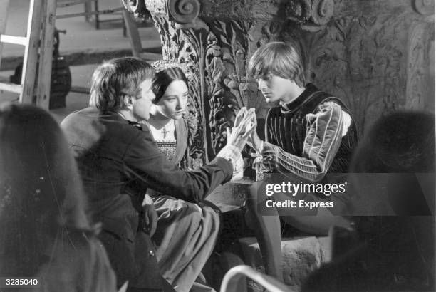 Italian stage and film director, Franco Zeffirelli with Olivia Hussey and Leonard Whiting, during the filming of 'Romeo and Juliet'.