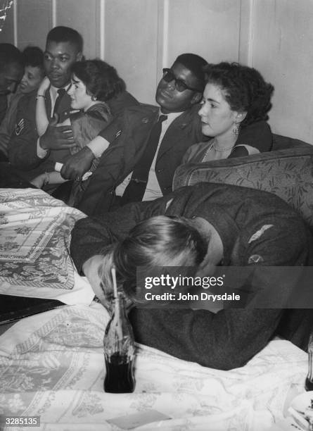 Young couples at an all-night jazz club in London's Piccadilly.