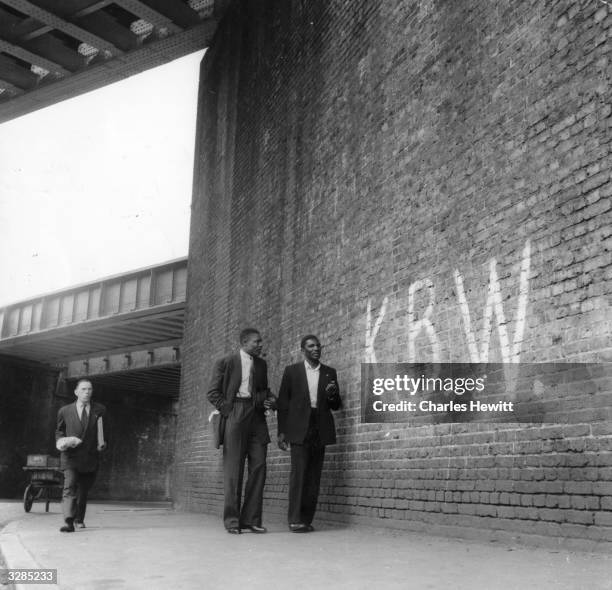 Racist graffiti painted onto brickwork in Brixton, south London, 1952. Original Publication: Picture Post - 6044 - Breeding A Colour Bar - pub. 6th...