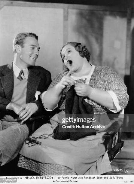 Randolph Scott and Kate Smith enjoying a laugh during the production of 'Hello Everybody'.