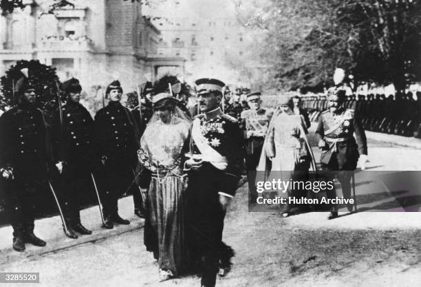 Queen Marie of Romania and King Alexander Karadjordjevic of Yugoslavia at the wedding of Prince Paul of Serbia and Princess Alex of Greece.