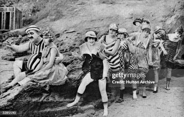 Bebe Daniels , Gloria Swanson , Mack Swain and a few more of the Mack Sennett bathing beauties seen here in a scene from 'College', one of Mack...