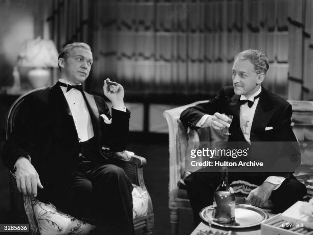 Lee Tracy and Otto Kruger in a scene from 'Turn Back The Clock', where a man dreams of changing places with his rich friend. The film was directed by...