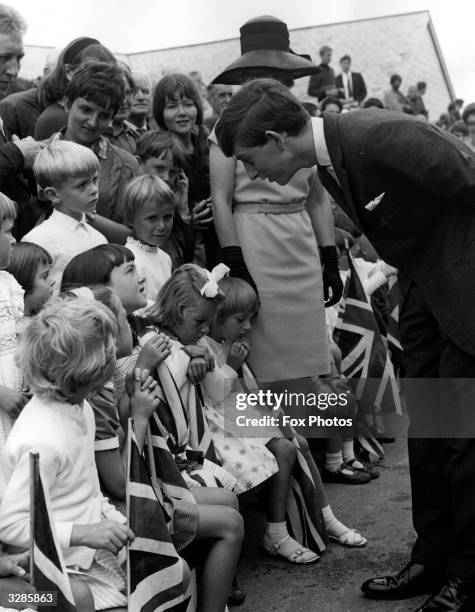Prince Charles talking to young well-wishers during a visit to the Scilly Isles.