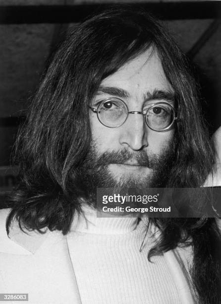 Singer, songwriter and guitarist John Lennon of The Beatles, at a press conference at Heathrow airport on his return from honeymoon with Yoko Ono.