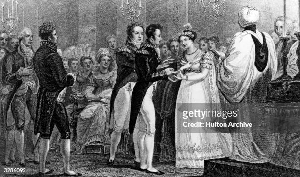 The wedding of Princess Charlotte Augusta of Britain , the daughter of King George IV, to Prince Leopold of Saxe-Coburg, the future King Leopold I of...