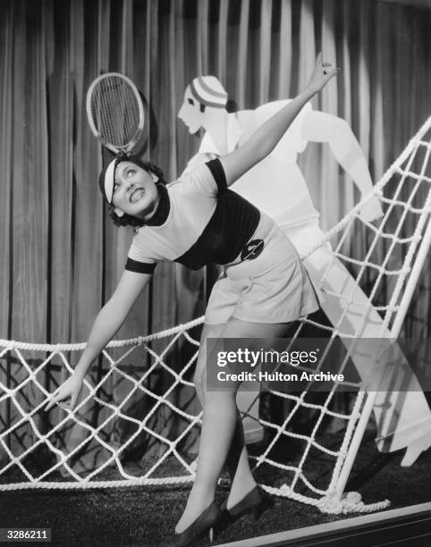 Dancer from the Paramount film 'College Rhythm', directed by Norman Taurog. The scene is a stylised representation of a game of tennis with a cut-out...