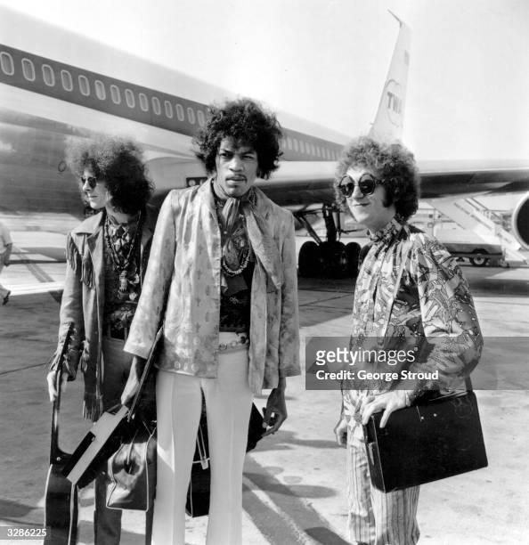 The Jimi Hendrix Experience at London Airport, from left to right; bass player Noel Redding , legendary guitarist Jimi Hendrix and drummer Mitch...
