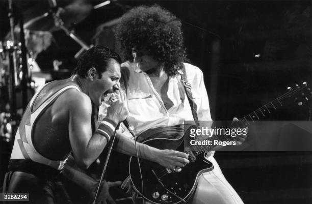 British rock group Queen in concert with singer Freddie Mercury and guitarist Brian May.