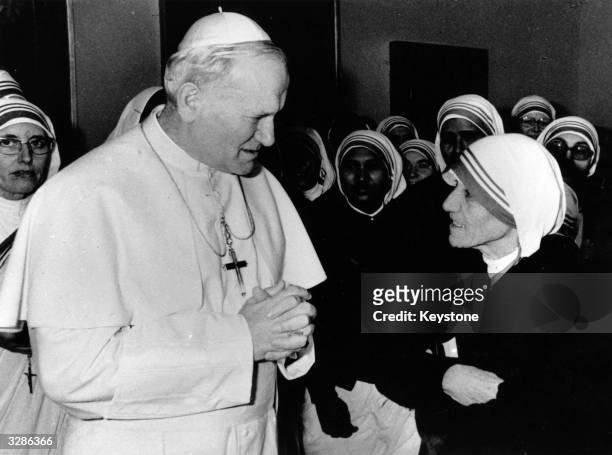 Pope John Paul II receiving Albanian nun Mother Teresa and a group of Indian nuns at the Vatican. Mother Teresa has just returned from Oslo, where...