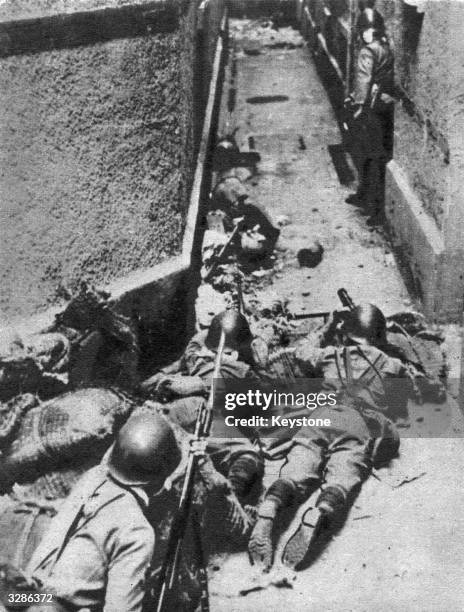 The Japanese army using 'infriltration' methods in a street in Burma, the technique they also use in jungle warfare.