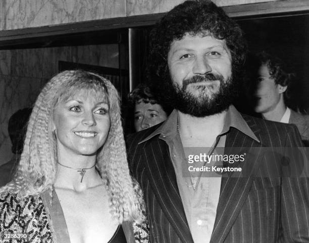 Radio 1 disc jockey Dave Lee Travis with his wife at the British premiere of the film 'Grease'.