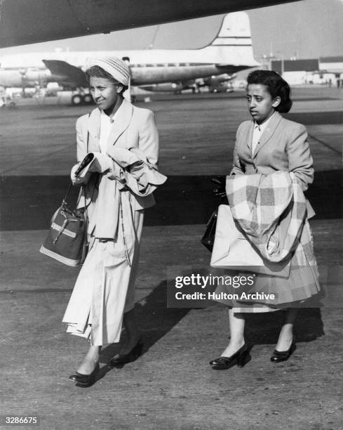 The granddaughters of Emperor Haile Selassie, Princess Mamite and Princess Sofia Desta, leaving London Airport to fly home to Addis Ababa for their...