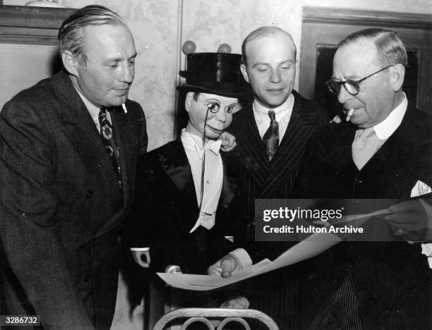 Edgar Bergen the Swedish_American ventriloquist who 'worked ' with 'Charlie McCarthy' discussing plans for a future performance with Jack Benny , the...