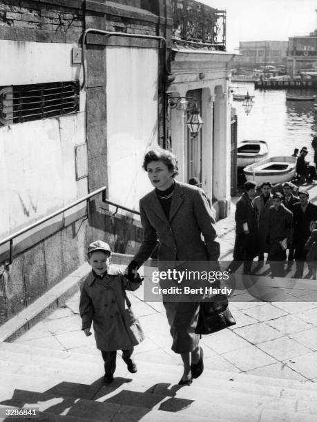 Swedish actress Ingrid Bergman takes a trip round Naples with her son Robertino. Original Publication: Picture Post - 6514 - Ingrid Bergman's Story -...