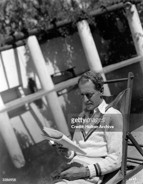 Otto Kruger, the popular Hollywood film actor, signed to MGM studios, relaxes in his garden in Beverly Hills.