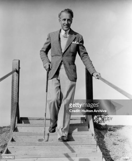 Otto Kruger, the Hollywood film actor who is signed to MGM and ace golfer, coming down some steps off the golf course.