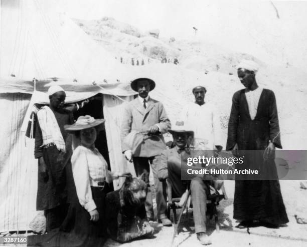 The digging camp in 1907 with Dr Howard Carter , English Egyptologist, seated at the time of the discovery of the tombs of Hatshepsut.