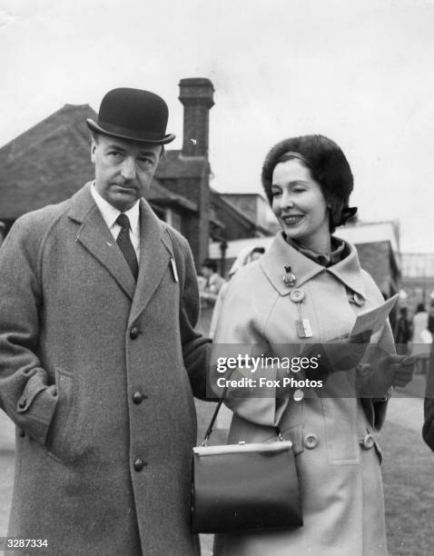 John Profumo, Secretary of State for War, and his wife the former actress Valerie Hobson at Sandown Park.