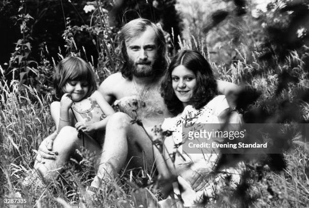 English singer-songwriter and drummer with rock group, Genesis, Phil Collins, with his first wife, Andrea Bertorelli, and her four year old daughter...