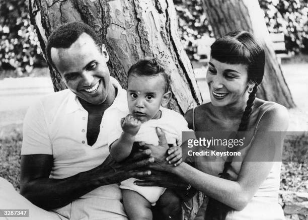 American calypso singing star Harry Belafonte enjoys a short holiday with his wife Julie Robynson and their nine month old son David near Genoa in...
