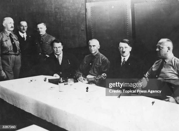 The heads of the Fascist Party in the Fraction Room of the Reichstag:- Adolf Hitler, leader; Dr Frick, Thuringian Minister of the Interior; Hermann...