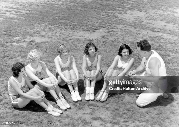 Gwen Lee with Ruth Holly, Blanche Le Clair, Raquel Torres and Fay Webb are all under the instruction of Dr Anderson, right, who exercises his MGM...