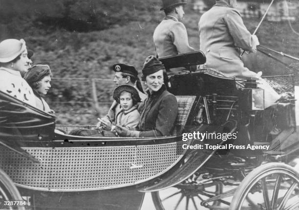 George, Duke of Kent with Marina, Duchess of Kent travelling in a carriage with Princess Margaret Rose , Princess Elizabeth and Queen Elizabeth,...