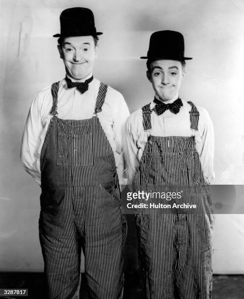 Stan Laurel, originally Arthur Stanley Jefferson , of the comedy duo Laurel and Hardy, with Harold Cordes, a 14 year old, winner of a 'doubles'...