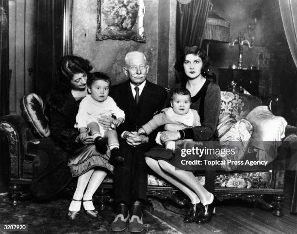 American actress Lita Grey , the wife of comic actor Charlie Chaplin, with her mother, her grandfather and her two sons by Chaplin, 16th December...