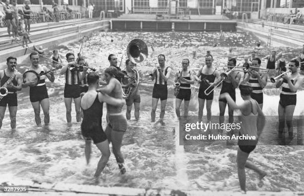 Jack Hylton's Band plays for bathers at the Luna Park Baths in Berlin.