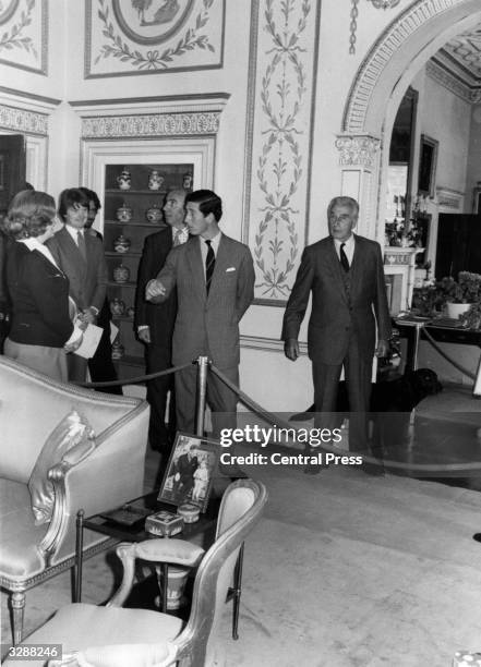 Charles, Prince of Wales and Lord Louis Mountbatten showing guests around Mountbatten's country home, Broadlands in Romsey, Hampshire during a public...