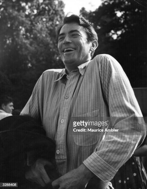 American leading actor Gregory Peck on location in London during the filming of 'The Million Pound Note', directed by Ronald Neame. Original...
