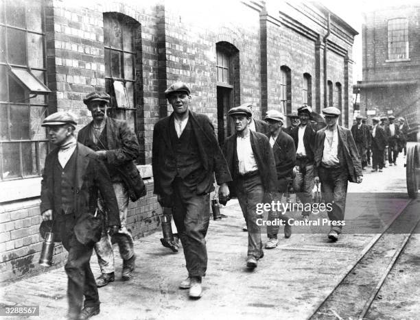 Miners from the colliery at Crown Farm near Mansfield, Nottingham on their way home from work.