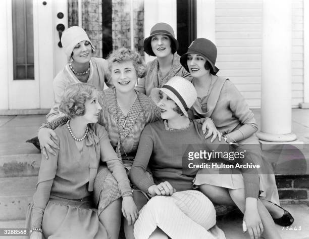 Bessie Love , the Hollywood actress who appeared in 'Dress Parade' poses with Leatrice Joy and other friends at her Hollywood home.
