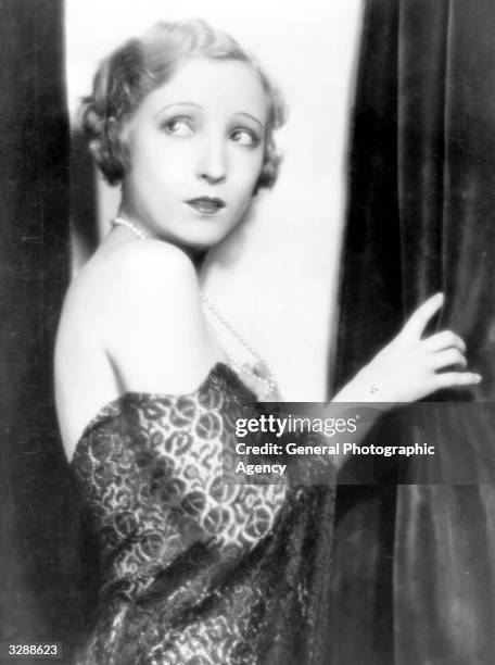 Hollywood actress Bessie Love , an MGM player, in an 'off the shoulder' dress.